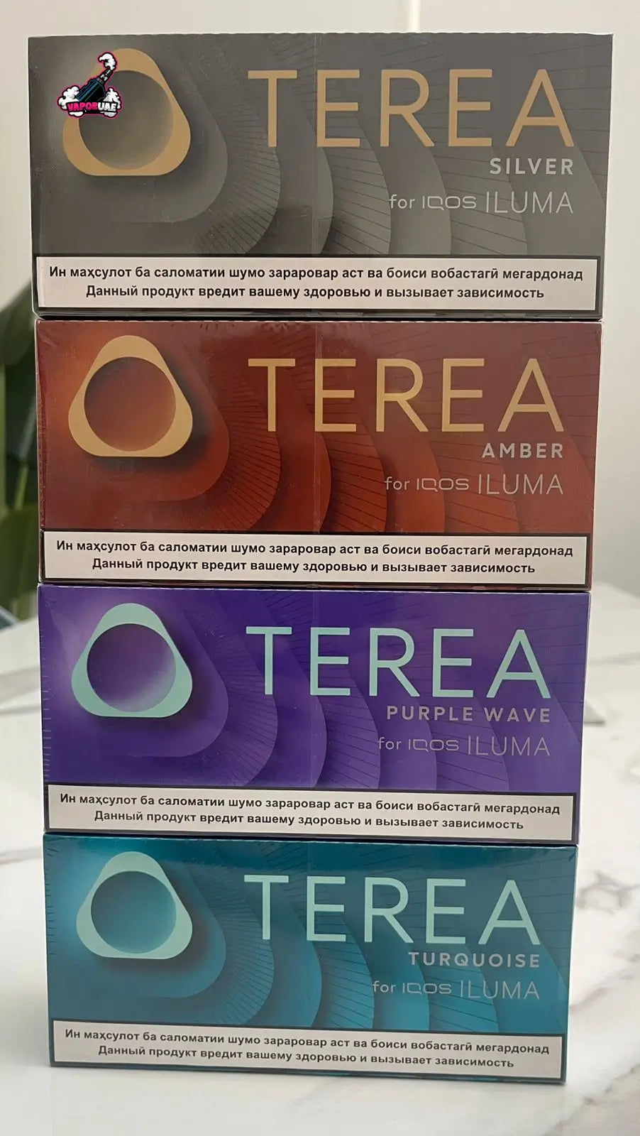 IQOS TEREA Kazakhstan Silver, Amber, Purple Wave & Turquoise flavor variants on a white background
