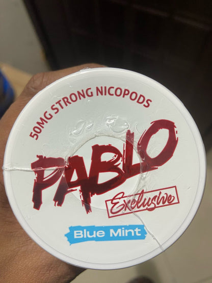 Pablo Nicotine Pouches Blue Mint flavor 50mg Strong Nicopods Container held by a hand