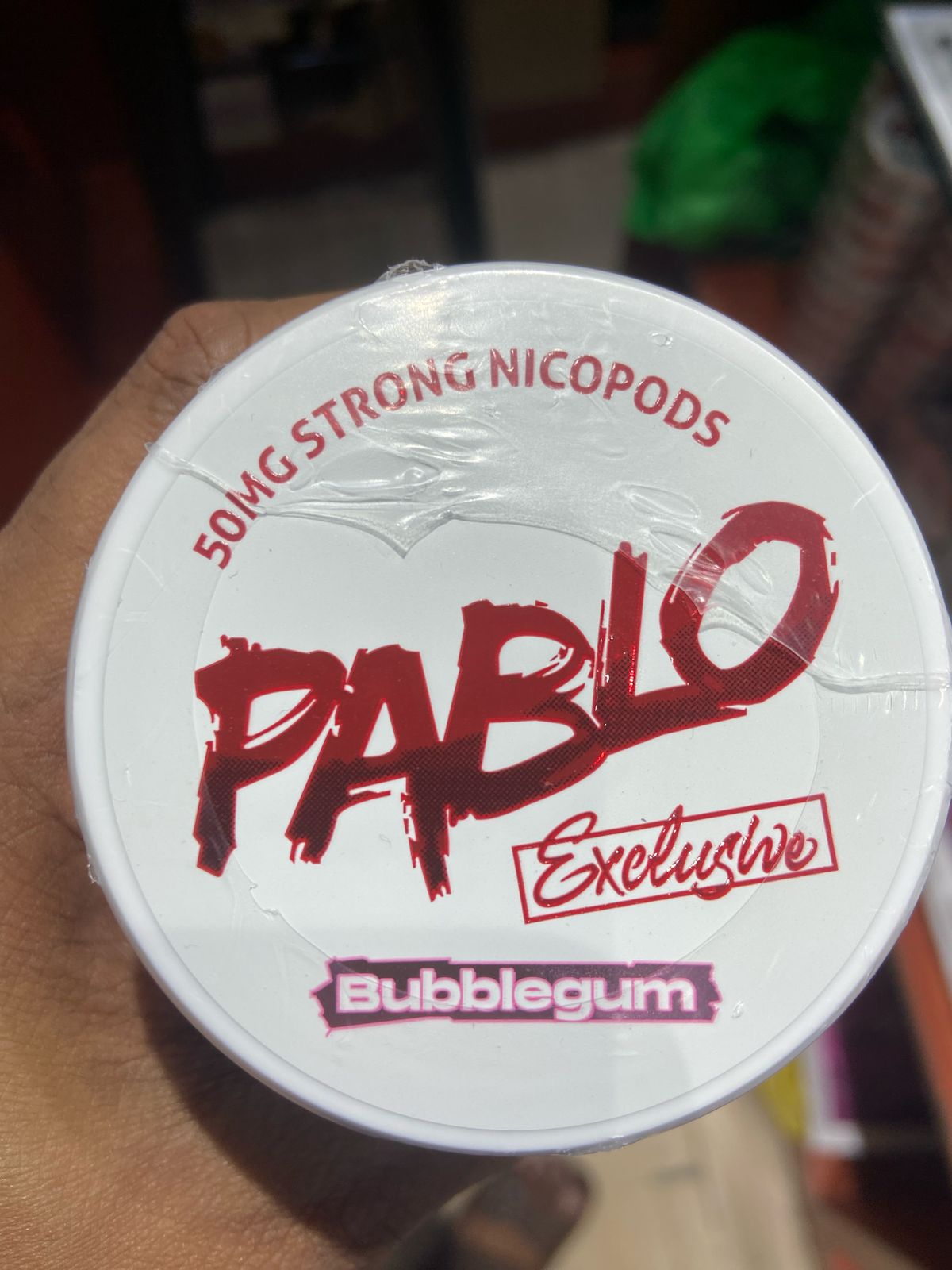 Pablo Nicotine Pouches Bubblegum flavor 50mg Strong Nicopods Container held by a hand