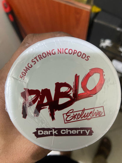 Pablo Nicotine Pouches Dark Cherry flavor 50mg Strong Nicopods Container held by a hand
