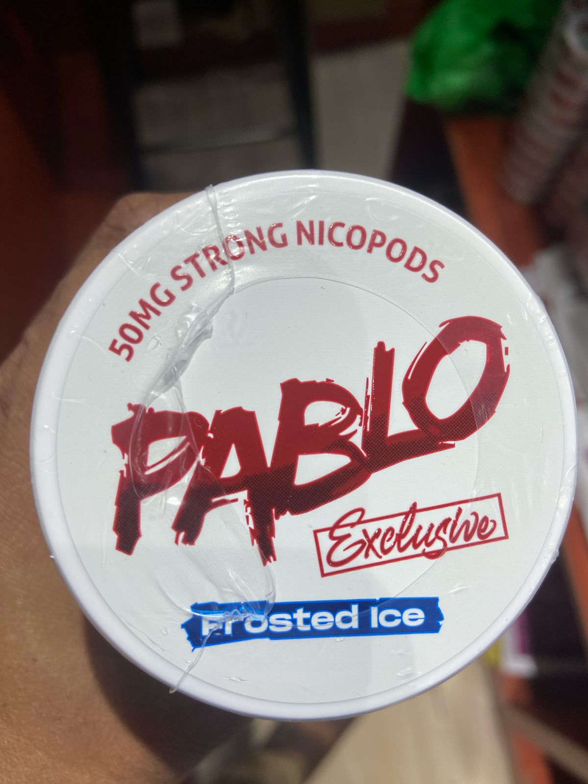 Pablo Nicotine Pouches Frosted Ice flavor 50mg Strong Nicopods Container held by a hand