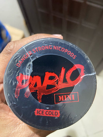 Pablo Nicotine Pouches Ice Cold flavor 50mg Strong Nicopods Container held by a hand