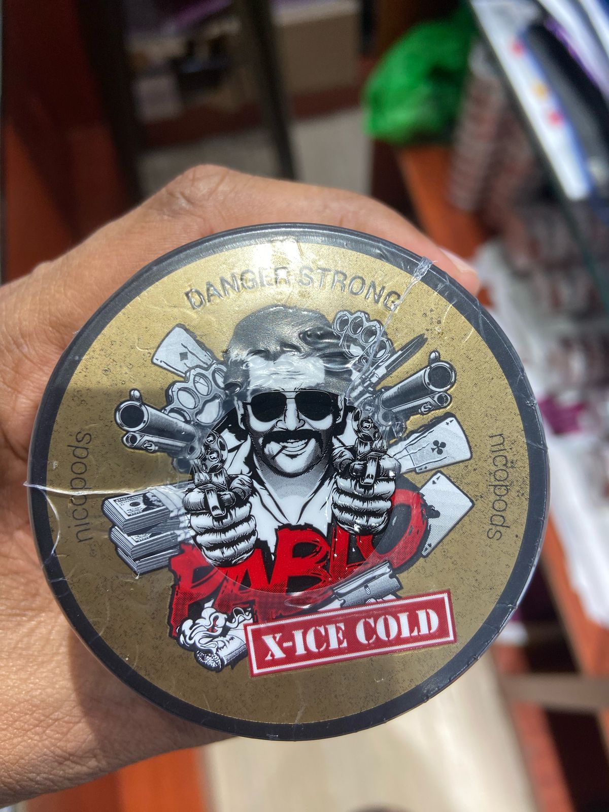 Pablo Nicotine Pouches X-Ice Cold flavor 50mg Strong Nicopods Container held by a hand