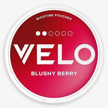 Red container of Velo nicotine pouches with 'Blushy Berry' flavor on a white background
