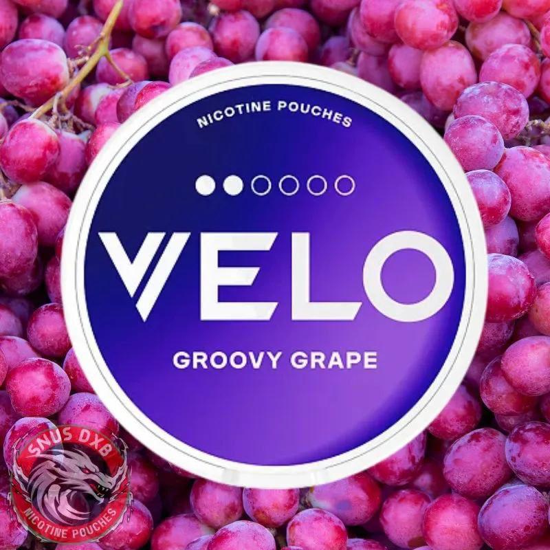 VELO nicotine pouches for snus with groovy grape flavor surrounded by grapes